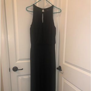 White House/Black Market black wide leg jumpsuit. Does has stretch to material.